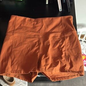 Jessica Simpson burnt orange athletic shorts